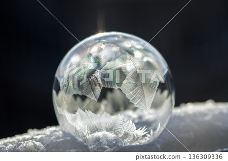 Beautiful Frozen Soap Bubble with Frosted Patterns 136309336