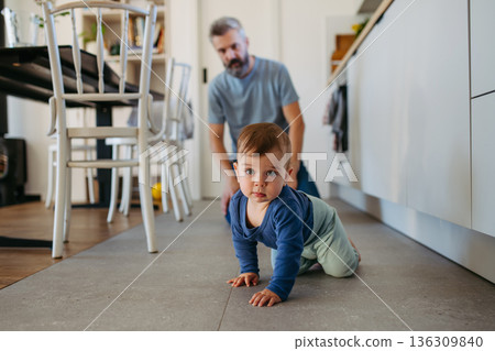 Father with little toddler son at home. Father with little toddler son at home. 136309840