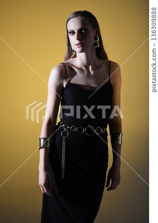 Woman posing in elegant black dress and fashion jewelry 136309888