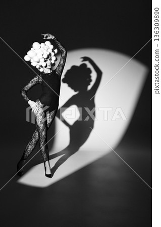 Dancer with spheres head shadow on wall 136309890