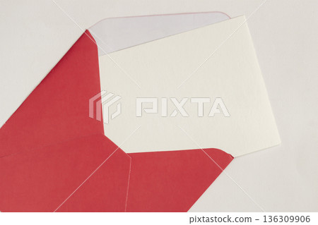 Red envelope with blank white card isolated on light background, flat lay composition with copy space for message. Concept of valentine communication, love letter mockup, background for card design 136309906