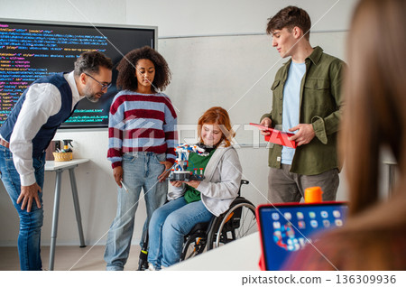 Inclusive student team presenting technology project in class. 136309936