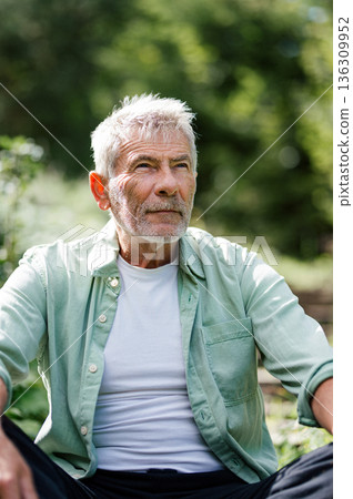 Portrait of older man in nature, enjoying sprintime. Portrait of older man in nature, enjoying sprintime. 136309952