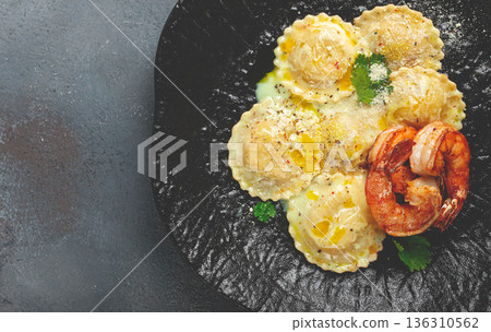 ravioli with shrimp, in cream sauce, with spices and herbs, top view, no people, 136310562