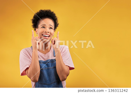 Smile, pointing and mockup with a black woman on a yellow background in studio for advertising or marketing. Sale, presentation or information with a happy young female brand ambassador showing space 136311242