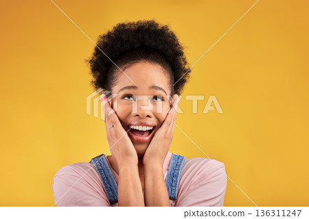 Thinking, surprise and woman with a smile, excited and expression on a yellow studio background. Female person, happiness and African model with shock, emoji and omg with good news, winning and wow Thinking, surprise and woman with a smile, excited and expression on a yellow studio background. Female person, happiness and African model with shock, emoji and omg with good news, winning and wow 136311247