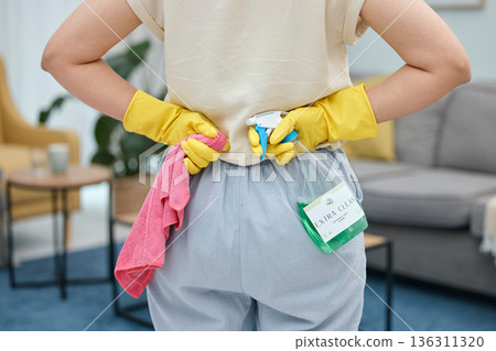 Back of woman, cleaning cloth and bottle with gloves for home disinfection of dirt, bacteria and dust. Closeup hands of female person ready for housekeeping with chemical spray and detergent product 136311320