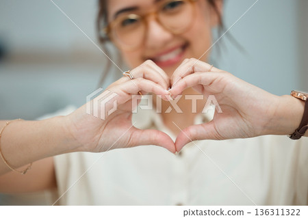 Heart, love and happy with hand of woman for thank you, support and peace. Kindness, hope and motivation symbol with closeup of female person and sign at home for emoji, care and romance icon Heart, love and happy with hand of woman for thank you, support and peace. Kindness, hope and motivation symbol with closeup of female person and sign at home for emoji, care and romance icon 136311322