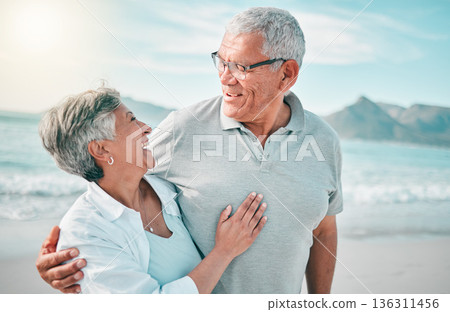 Happy, hug or old couple laughing on beach with love, care or support on summer vacation in nature. Retirement, mature man talking or funny senior woman at sea or ocean to travel on holiday together Happy, hug or old couple laughing on beach with love, care or support on summer vacation in nature. Retirement, mature man talking or funny senior woman at sea or ocean to travel on holiday together 136311456