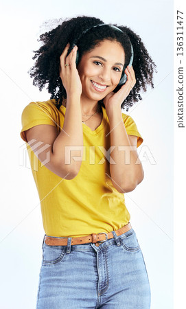 Portrait, music and happy woman with headphones in studio for streaming, subscription or service on white background. Smile, face and lady listen to radio, podcast or online audio earphones playlist Portrait, music and happy woman with headphones in studio for streaming, subscription or service on white background. Smile, face and lady listen to radio, podcast or online audio earphones playlist 136311477