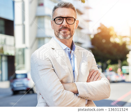 Arms crossed, portrait and business man in city for professional, executive and corporate. Ceo, manager and mission with mature person in street in New York for pride, confidence and entrepreneur Arms crossed, portrait and business man in city for professional, executive and corporate. Ceo, manager and mission with mature person in street in New York for pride, confidence and entrepreneur 136311524