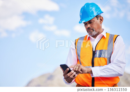Phone, construction worker and typing communication in the city for planning, building and project management with engineer. Cellphone, online conversation and senior man with internet connection Phone, construction worker and typing communication in the city for planning, building and project management with engineer. Cellphone, online conversation and senior man with internet connection 136311550