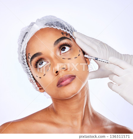 Plastic surgery, beauty and hyaluronic acid with face of woman in studio for lip filler, skincare or collagen. Spa treatment, medical and cosmetics with model on white background for facial injection Plastic surgery, beauty and hyaluronic acid with face of woman in studio for lip filler, skincare or collagen. Spa treatment, medical and cosmetics with model on white background for facial injection 136311571