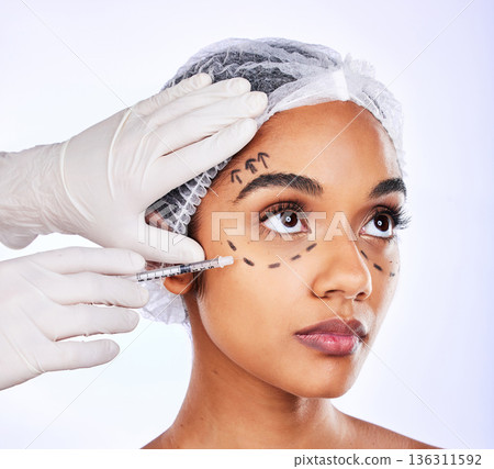 Plastic surgery, spa and injection with face of woman in studio for hyaluronic acid, skincare and collagen. Beauty treatment, medical and cosmetics with person on white background for facial filler 136311592