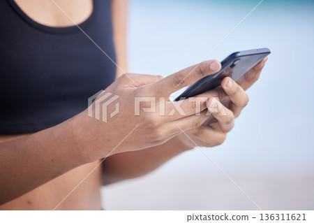 Fitness woman, phone and hands typing for communication, social media or outdoor networking. Closeup of female person chatting or texting on mobile smartphone app for online browsing or research Fitness woman, phone and hands typing for communication, social media or outdoor networking. Closeup of female person chatting or texting on mobile smartphone app for online browsing or research 136311621