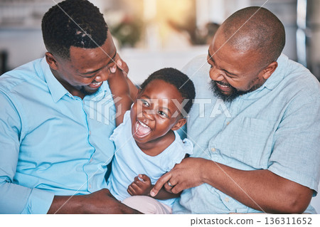Black family, grandfather or dad playing with child bonding or laughing to relax together at home. African grandpa, happy funny kid or happy dad tickling girl with care, smile or love enjoying humor 136311652