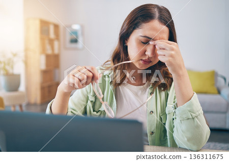 Headache, stress and woman on laptop in home with deadline for project, report and online task. Remote work, overworked and female person with burnout, frustrated and worry for freelance business 136311675