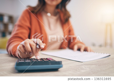 Finance, woman and hands at calculator for budget, taxes report and accounting documents at home. Closeup of person, notes and planning savings, investment money or administration for financial bills Finance, woman and hands at calculator for budget, taxes report and accounting documents at home. Closeup of person, notes and planning savings, investment money or administration for financial bills 136311695