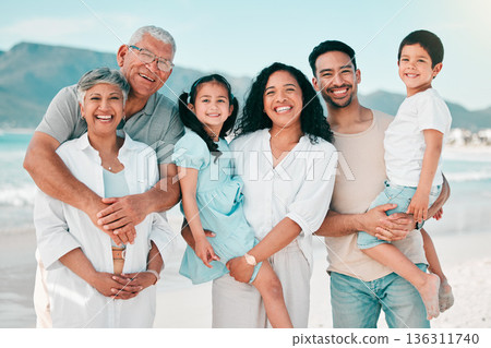 Grandparents, parents or portrait of children at beach as a happy big family for holiday vacation travel. Grandfather, grandmother or mom with dad or kids siblings in nature at sea bonding together Grandparents, parents or portrait of children at beach as a happy big family for holiday vacation travel. Grandfather, grandmother or mom with dad or kids siblings in nature at sea bonding together 136311740