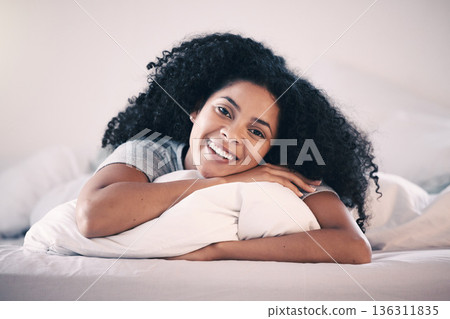 Happy, smile and portrait of a woman in bed relaxing in the morning on a weekend at her home. Happiness, rest and calm young female person from Colombia lying in the bedroom of her modern apartment. Happy, smile and portrait of a woman in bed relaxing in the morning on a weekend at her home. Happiness, rest and calm young female person from Colombia lying in the bedroom of her modern apartment. 136311835