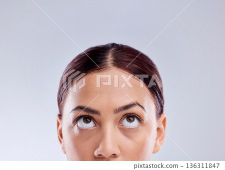 Looking up, mockup or woman thinking of idea in studio isolated on white background to promote beauty. Marketing, natural glowing skincare or face of female model with mock up space for advertising Looking up, mockup or woman thinking of idea in studio isolated on white background to promote beauty. Marketing, natural glowing skincare or face of female model with mock up space for advertising 136311847