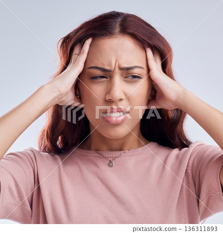 Woman, pain and headache, stress or health problem with brain fog or anxiety isolated on white background. Crisis, disaster and female person with a migraine, sick and dizzy with fatigue in studio 136311893
