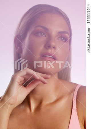 Beauty, makeup and young woman in a studio with a natural, glamour and luxury face routine. Cosmetic, attractive and female model from Australia with facial cosmetology isolated by a pink background. Beauty, makeup and young woman in a studio with a natural, glamour and luxury face routine. Cosmetic, attractive and female model from Australia with facial cosmetology isolated by a pink background. 136311944