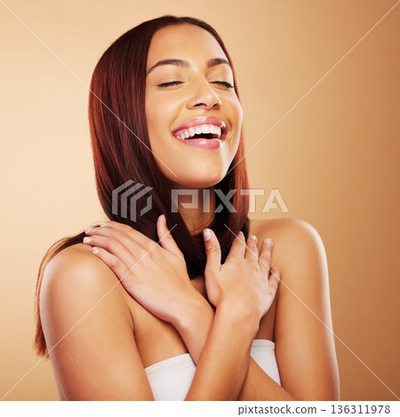 Hair care, beauty and woman with smile, hands on skin and luxury salon treatment on brown background. Aesthetic glow, haircut and haircare, happy face of model with cosmetics and makeup in studio. 136311978