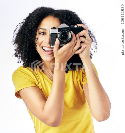 Photography, camera and happy woman photographer and smile as a creative isolated in a studio white background. Portrait, photoshoot and artistic person with a hobby and takes picture of memory 136311989