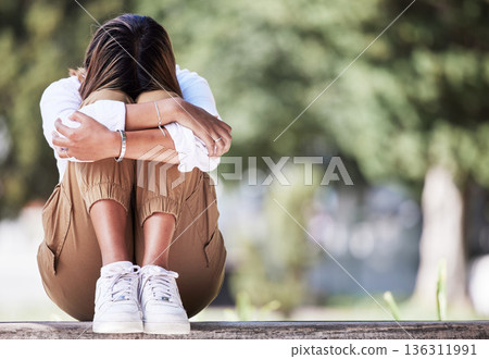 Sad, cry and student with woman in park for depression, frustrated and stress. Mental health, anxiety and fear with female person in nature for psychology, tired and fatigue with mockup space Sad, cry and student with woman in park for depression, frustrated and stress. Mental health, anxiety and fear with female person in nature for psychology, tired and fatigue with mockup space 136311991