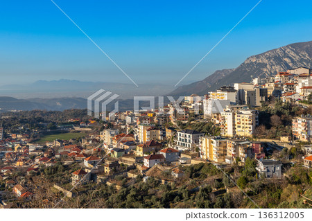 Panoramic view of a hillside residential district with traditional and modern buildings with mountain Balkan landscape, Kruja, Albania 136312005