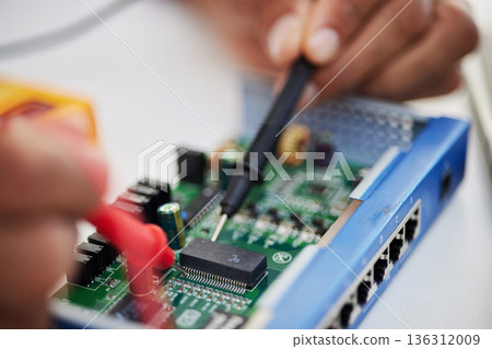Motherboard, hands and technology with microchip, engineering and repair closeup. IT, hardware and electrical person working on maintenance, problem solving and circuit check of battery with tools 136312009