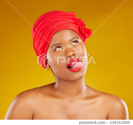 Tongue, fashion and a black woman with makeup on a studio background for beauty and comedy. Idea, playful and a funny face of African girl or model with a headscarf, cosmetics and funny on a backdrop Tongue, fashion and a black woman with makeup on a studio background for beauty and comedy. Idea, playful and a funny face of African girl or model with a headscarf, cosmetics and funny on a backdrop 136312085