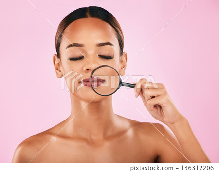 Woman, face and magnifying glass, beauty and investigation, skincare and makeup isolated on pink background. Search, zoom in on pores and check skin with glow, female model and dermatology in studio Woman, face and magnifying glass, beauty and investigation, skincare and makeup isolated on pink background. Search, zoom in on pores and check skin with glow, female model and dermatology in studio 136312206