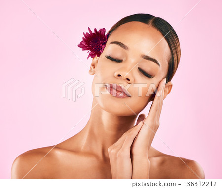 Woman, face and flower, natural beauty and eco friendly skincare with nature aesthetic on pink background. Female model, cosmetic and sustainable dermatology, makeup and organic facial in studio Woman, face and flower, natural beauty and eco friendly skincare with nature aesthetic on pink background. Female model, cosmetic and sustainable dermatology, makeup and organic facial in studio 136312212