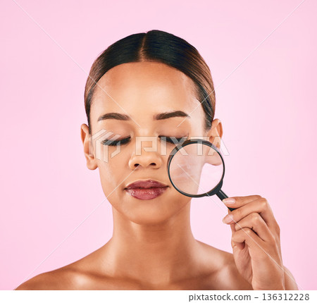 Woman, face and magnifying glass, beauty and zoom in on pores, skincare and makeup isolated on pink background. Search, investigate and check skin with glow, female model and dermatology in studio Woman, face and magnifying glass, beauty and zoom in on pores, skincare and makeup isolated on pink background. Search, investigate and check skin with glow, female model and dermatology in studio 136312228