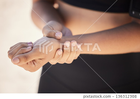 Fitness, closeup and woman with a wrist injury, accident or sprain muscle after a workout. Sports, medical emergency and zoom of a female athlete with hand joint pain after a exercise or training. Fitness, closeup and woman with a wrist injury, accident or sprain muscle after a workout. Sports, medical emergency and zoom of a female athlete with hand joint pain after a exercise or training. 136312308
