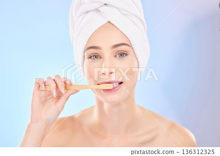 Beauty, dental and brushing teeth with portrait of woman in studio for wellness, self care and skincare. Product, shower and cleaning with person on blue background for cosmetics and oral hygiene Beauty, dental and brushing teeth with portrait of woman in studio for wellness, self care and skincare. Product, shower and cleaning with person on blue background for cosmetics and oral hygiene 136312325