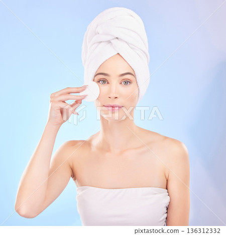Skincare, face pad and portrait of woman in studio for a natural, self care and spa routine. Beauty, health and young female model from Australia with clean skin treatment isolated by blue background Skincare, face pad and portrait of woman in studio for a natural, self care and spa routine. Beauty, health and young female model from Australia with clean skin treatment isolated by blue background 136312332