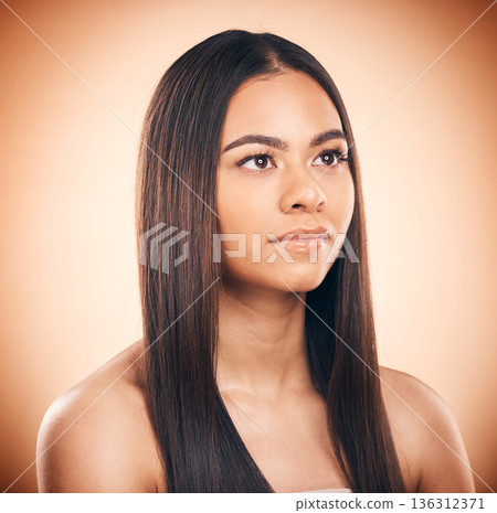 Beauty, skincare and hair with face of woman in studio for self care, cosmetics and glow. Makeup, spa and salon treatment with female model on brown background for wellness, hairstyle and shampoo 136312371