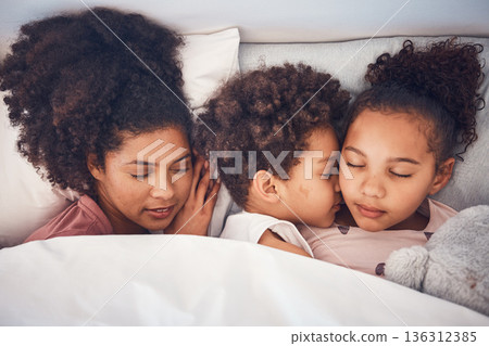 Mother, children and sleeping in bed together at home for security, bonding and comfort. Healthy, peace and a woman and kids nap, dream and rest or relax in a bedroom with love, care and safety 136312385
