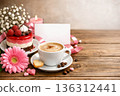 Holiday greeting template featuring morning coffee, dessert, flowers and candle with blank card. 136312441