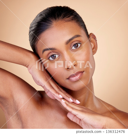 Skincare, beauty and portrait with indian girl for glow or self care in brown studio, background. Dermatology, girl and natural cosmetic with spa treatment for luxury facial in mock up for wellness. Skincare, beauty and portrait with indian girl for glow or self care in brown studio, background. Dermatology, girl and natural cosmetic with spa treatment for luxury facial in mock up for wellness. 136312476