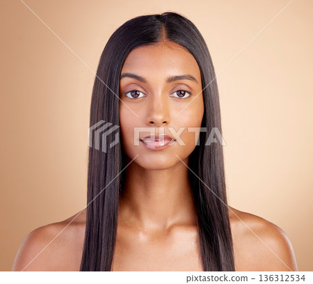 Portrait, hair care and Indian woman with beauty, cosmetics and dermatology on a brown studio background. Face, female person or model with volume, wellness or scalp treatment with aesthetic or shine Portrait, hair care and Indian woman with beauty, cosmetics and dermatology on a brown studio background. Face, female person or model with volume, wellness or scalp treatment with aesthetic or shine 136312534