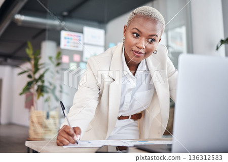 Business woman, reading research and graphic designer with notes and planning for project. Company, African female person and design strategy in a office writing information for website at agency Business woman, reading research and graphic designer with notes and planning for project. Company, African female person and design strategy in a office writing information for website at agency 136312583
