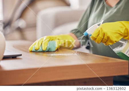 Hands, gloves and cleaning service a table in a home with safety from germs or dirt. Cleaner, dust and rubber protection with spray for household maintenance with a woman in a clean apartment 136312602