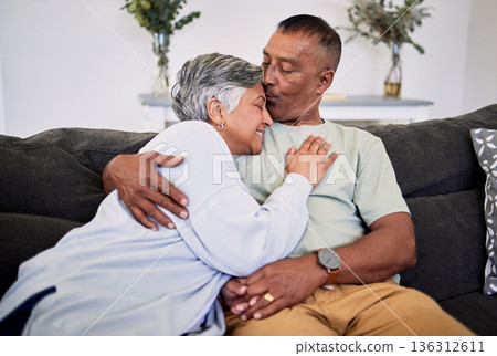 Love kiss, home or elderly couple smile, hug and enjoy quality time together, care or romance on lounge couch. Marriage support, living room sofa or senior husband, old wife or bonding people embrace Love kiss, home or elderly couple smile, hug and enjoy quality time together, care or romance on lounge couch. Marriage support, living room sofa or senior husband, old wife or bonding people embrace 136312611