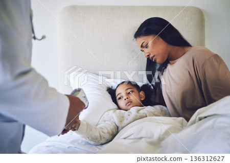 Doctor, mother and daughter with fever, thermometer and check with worry, health and temperature in bed. Medic, inspection or exam for flu, sick child and mom in bedroom for wellness in family house 136312627