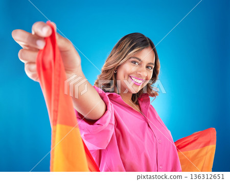 LGBTQ woman, flag and studio portrait with beauty, peace and freedom with pride for inclusion by blue background. Lesbian girl, student or model with smile for protest, icon or advocate for sexuality 136312651
