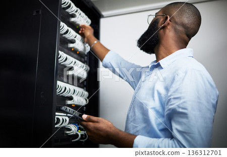 Server room, tablet and technician man with cable for internet connection for software programming. Engineer black person with tech for cybersecurity, hardware wire or maintenance in data center 136312701